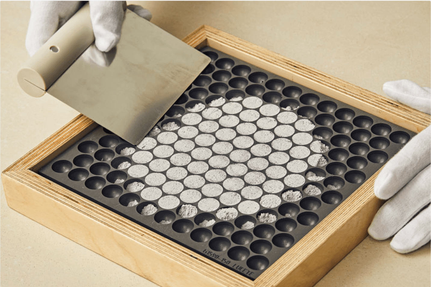 Cremated remains being placed into individual molds
